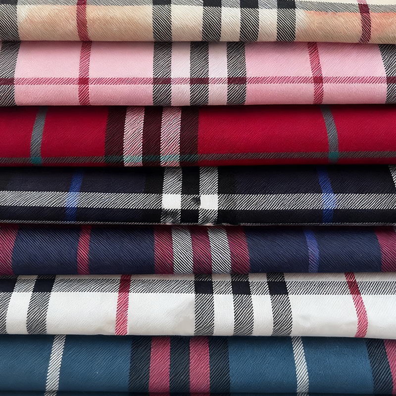 How does plaid fabric imbue flat fabric with a sense of depth and a sophisticated visual texture?
